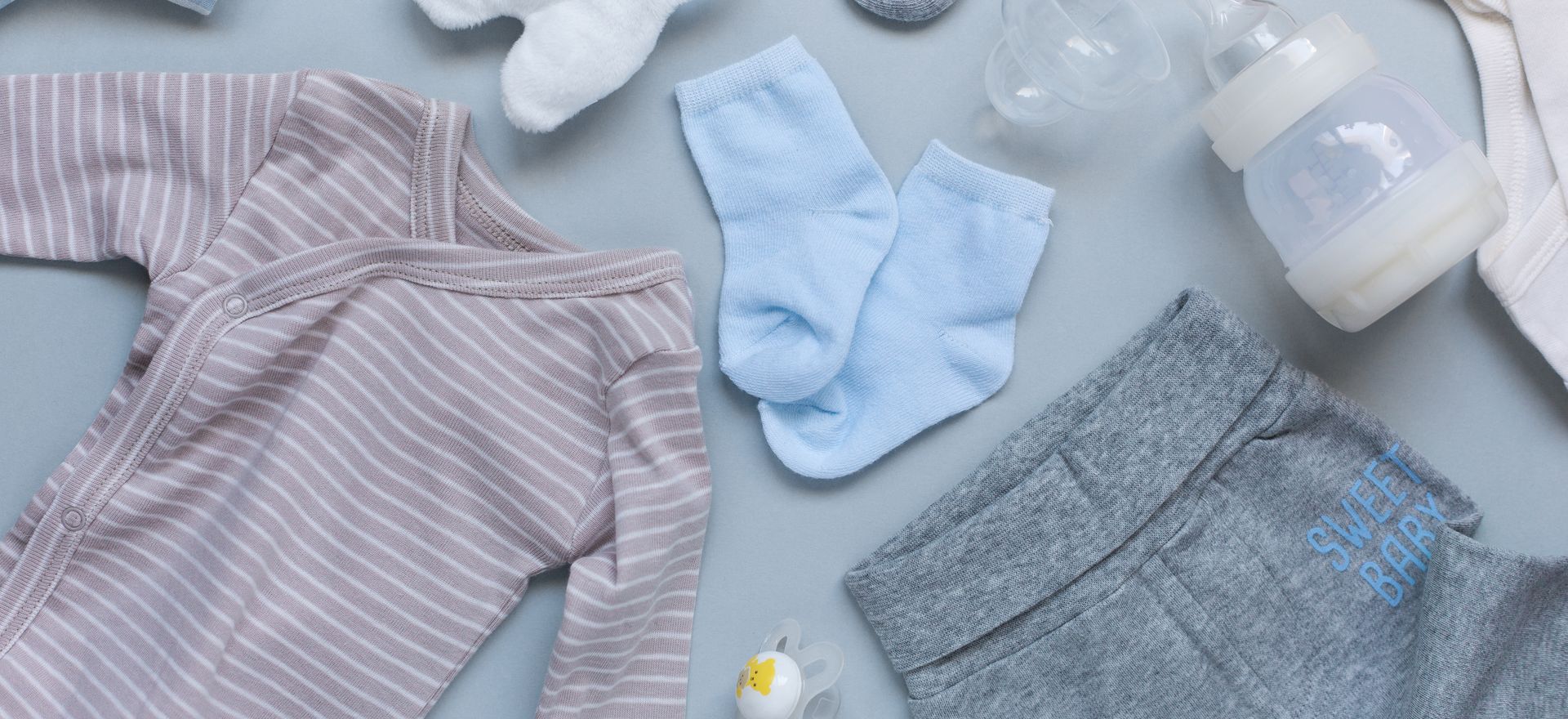 Baby goods on light blue background